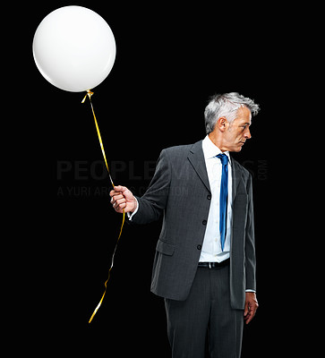 Male executive holding balloon