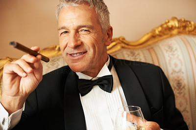Good looking man with cigar and brandy