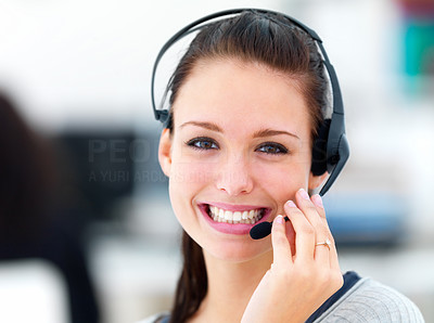 Closeup of a happy young woman wearing headphones