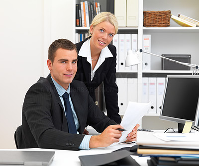 Businessman and woman working in office