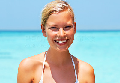 Beautiful young woman in bikini with sweet smile