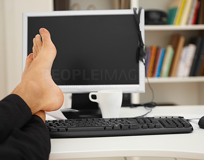 Closeup of legs of a man relaxing at office