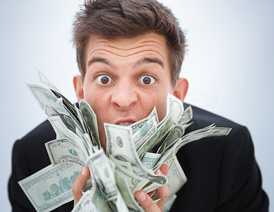 Closeup of a young business man holding money