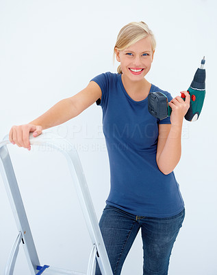 Beauty girl with drill machine on white background
