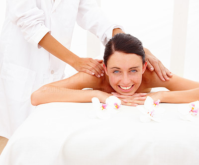 Beautiful woman receiving shoulder massage