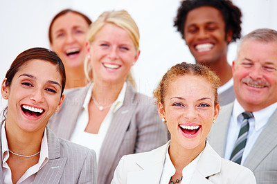 Closeup portrait of happy executives against white