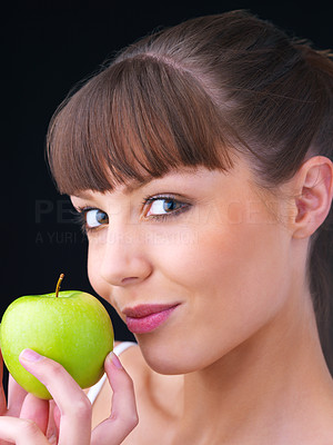 Girl holding a green apple
