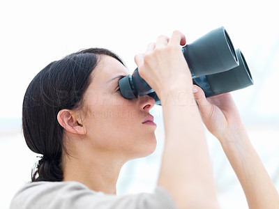 Young lady looking through binoculars