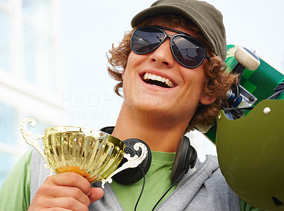 Happy young guy holding cup