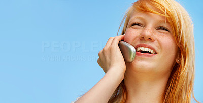 Young woman chatting on her mobile phone