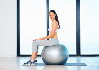 Woman relaxing on fitness ball