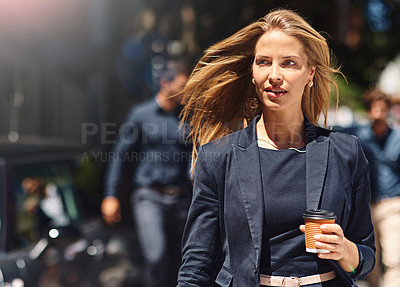 Buy stock photo Shot of a confident and stylishly dressed businesswoman walking down the street