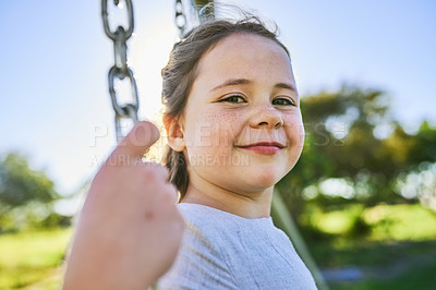 Buy stock photo Portrait of a cute little girl sitting on a swing in a park