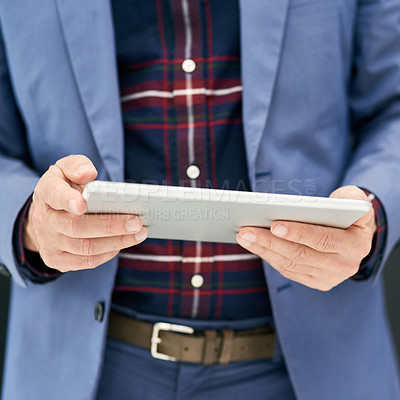 Buy stock photo Closeup shot of a businessman using a digital tablet