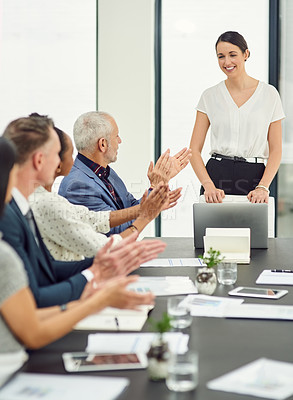 Buy stock photo Cropped shot of businesspeople applauding a colleague's presentation during a boardroom meeting
