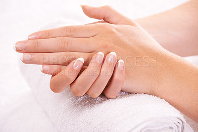Resting her hands on a soft towel