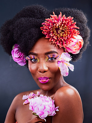 Pics of Studio shot of a beautiful young woman posing with flowers in her hair, stock photo, images and stock photography PeopleImages.com. Picture 2094165