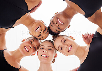 Buy stock photo Shot of a group of young female ballerinas in a huddle