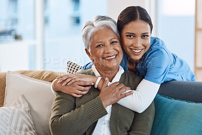 Buy stock photo Cropped portrait of an attractive young female nurse embracing her senior patient