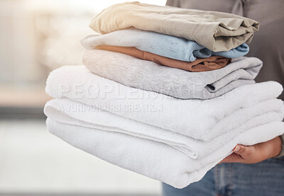 Buy stock photo Shot of an unrecognizable person doing laundry at home