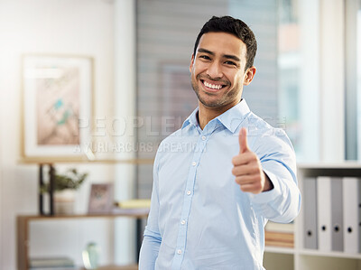Buy stock photo Shot of a young businessman giving the thumbs up