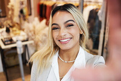 Buy stock photo Shot of a young woman taking selfies while shopping