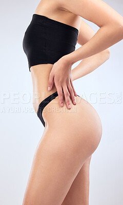 Buy stock photo Studio shot of an unrecognisable woman’s beautiful body against a grey background