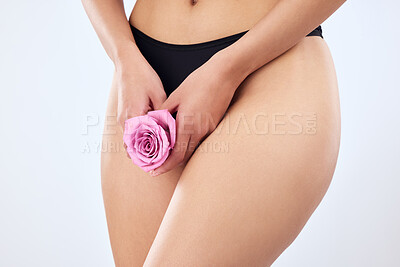 Buy stock photo Studio shot of an unrecognizable woman posing in her underwear against a grey background