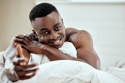 Buy stock photo Portrait of a handsome young man lying on his bed
