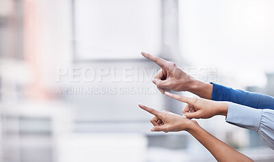 Buy stock photo Shot of a group of unrecognizable businesspeople pointing their fingers against a city background