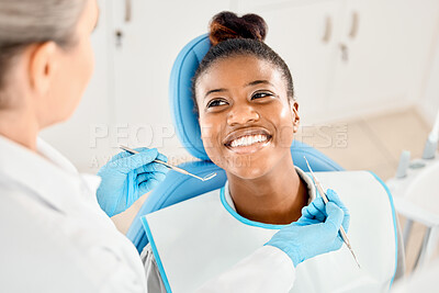 Buy stock photo Shot of a young woman at her dental checkup