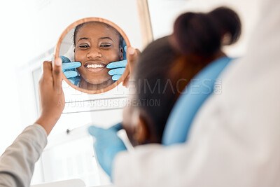 Buy stock photo Shot of a young woman checking her dental work in a mirror