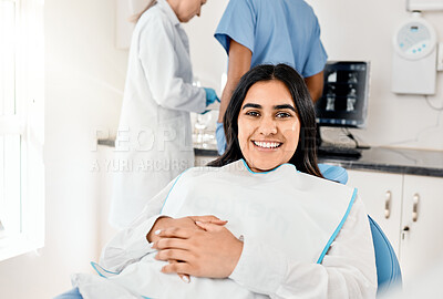 Buy stock photo Shot of a young woman awaiting treatment in her dentists office