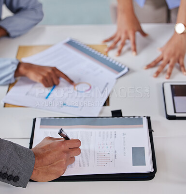 Buy stock photo Shot of a businessman looking at paperwork in an office
