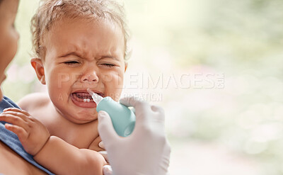 Buy stock photo Shot of a doctor using a section tool to relieve a baby's phlegm