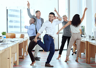 Buy stock photo Shot of a group of businesspeople dancing in an office at work