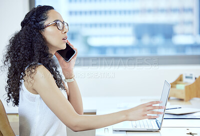 Buy stock photo Shot of a young businesswoman on a call in an office at work