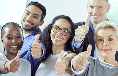 Buy stock photo Shot of a group of businesspeople showing a thumbs up at work