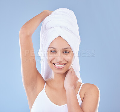 Buy stock photo Shot of a beautiful young woman posing with a towel wrapped around her head