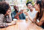 Group of excited diverse friends taking meeting to hangout and drinking coffee outside at a coffee shop. Cheerful, mixed race students relaxing and drinking tea. Friends bonding on a sunny day