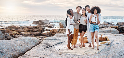 Buy stock photo A group of friends enjoying their time together and drinking some alcoholic drinks at the beach