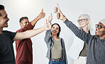 Group happy of diverse businesspeople showing a thumbs up standing together in a meeting in an office at work. Men and woman smiling and holding up a thumb in agreement and support