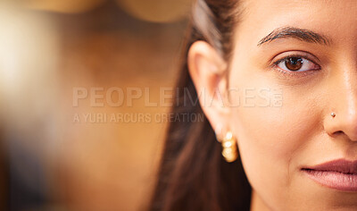Buy stock photo Closeup portrait of a beautiful young woman with smooth flawless skin. Indian female showing off her natural beauty and clear complexion while posing with a nose piercing. 