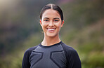 Beautiful, athletic, mixed race young woman exercising outside in a forest. Healthy and sporty female athlete out for a jog in nature. Some endurance and cardio during a workout in the woods