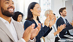 Happy young asian businesswoman clapping hands for presentation during a meeting in an office boardroom with colleagues. Diverse group of smiling businesspeople sitting in a row on a panel as audience and applauding after an inspiring and motivating talk