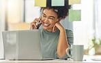 Happy mixed race woman on a call with her cellphone while working on a laptop sitting at a table at home. Cheerful hispanic female with a curly afro laughing while talking on the phone alone in the lounge at home