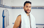 Portrait of a handsome mixed race athlete. Fit young man resting in his gym locker room. Young man taking a break from a squash match to relax in his gym locker room. Happy player in his gym