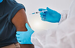 Hands of a doctor ready to inject a patient with the covid vaccine. Healthcare professional injecting a patient with corona virus cure cropped. Patient receiving medicine via injection