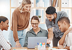 Group of happy diverse colleagues brainstorming together on laptop in an office boardroom. Caucasian businesswoman meeting to explain ideas and strategy as manager to her team in a creative startup agency