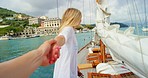 Happy woman leading her friend holding her hand to the front of a boat. Happy woman on a cruise with her friend walking to the front of the boat on the Italian ocean. Two happy women on a cruise